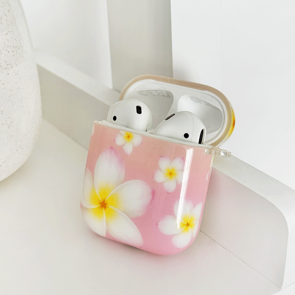 Pink AirPods Case with white hibiscus flower design.