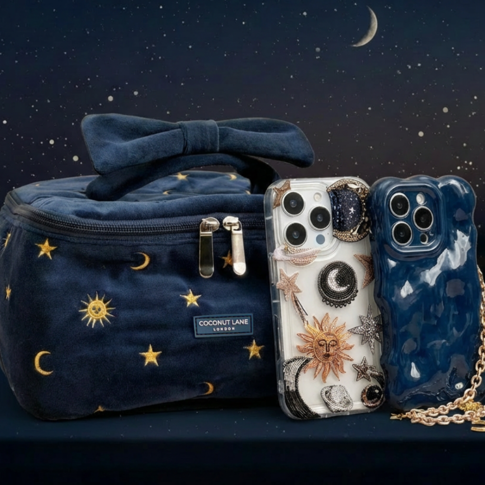 Clear Celestial Coconut Lane phone case with stars and a navy star-patterned bag under a glowing crescent moon.