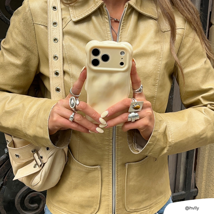 Girl in yellow jacket holding 3D Bubble Phone Case in Butter Yellow