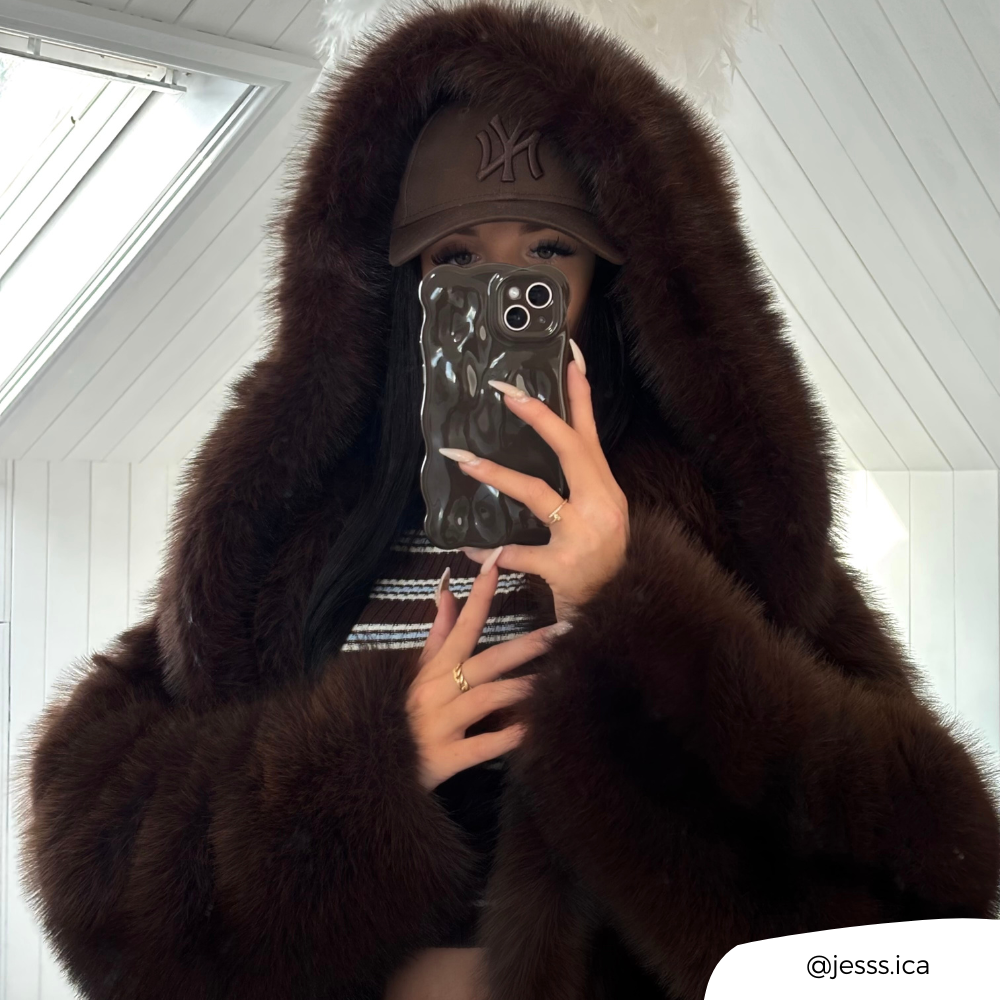 Girl taking mirror selfie with 3D Bubble Chocolate wearing a fur coat