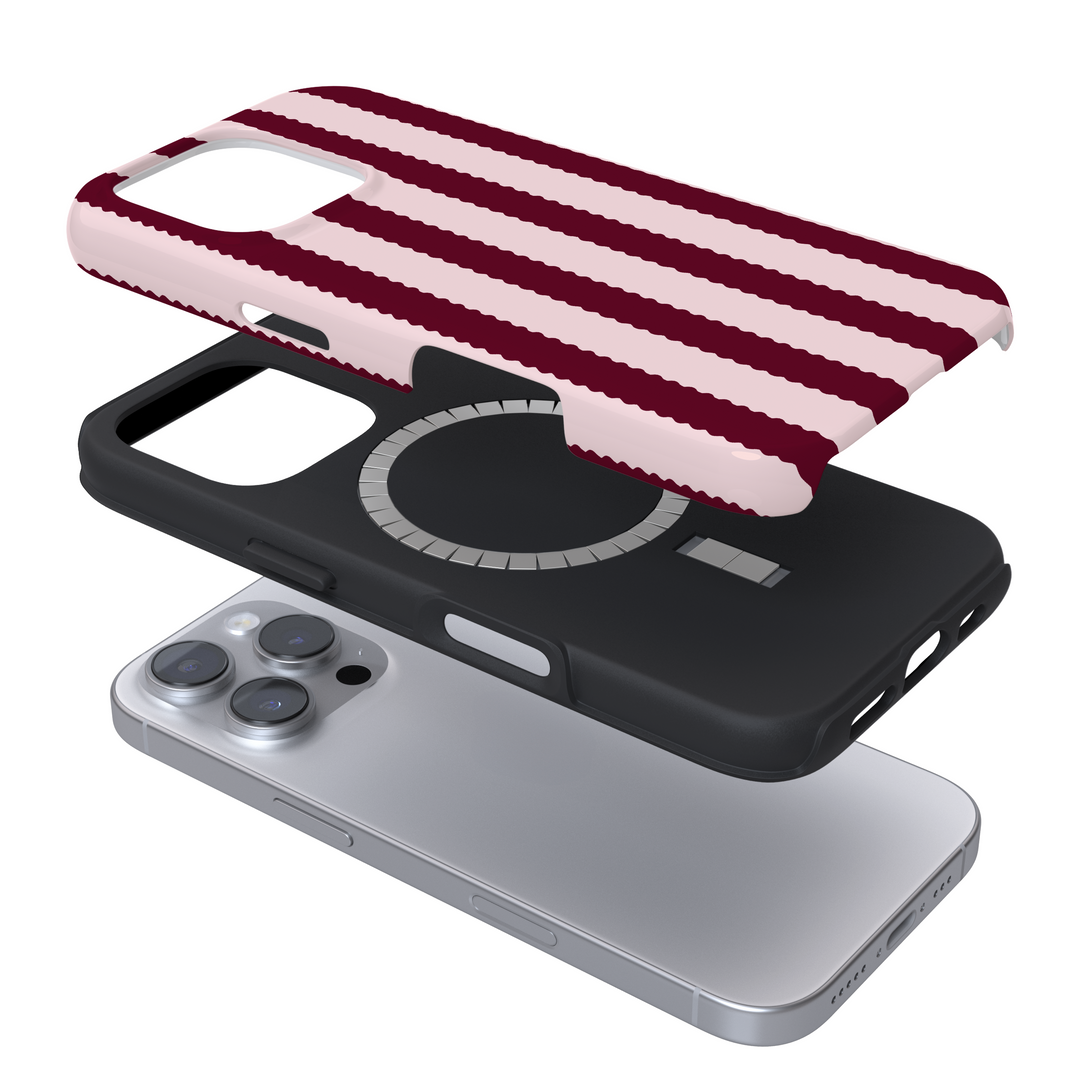 Smartphone shown with Coconut Lane Tough MagSafe® Case in blush pink scallop stripe pattern above it.