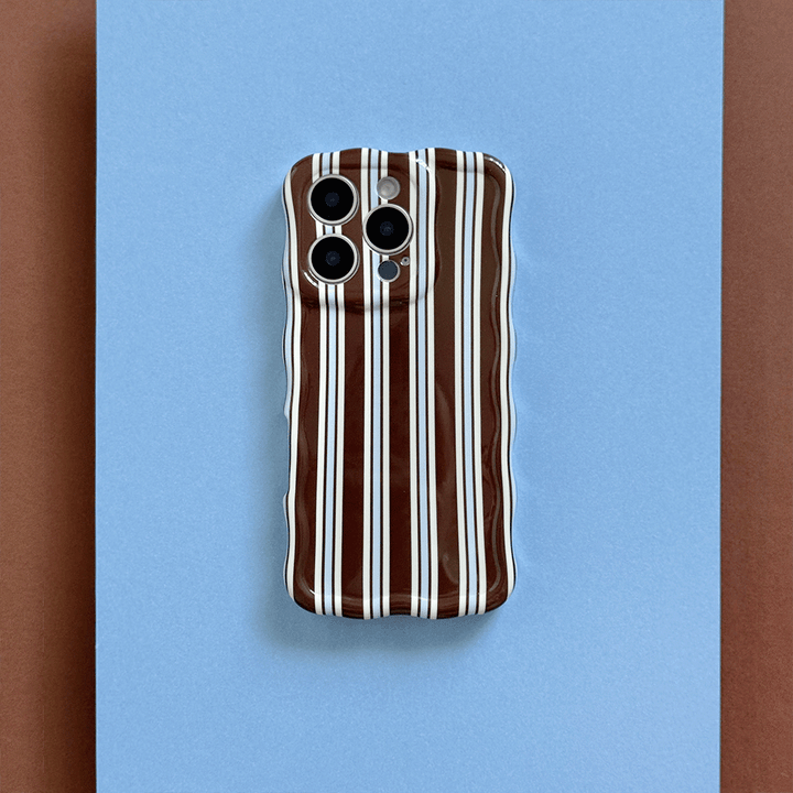 Phone Case with brown and white vertical stripes on a blue background.