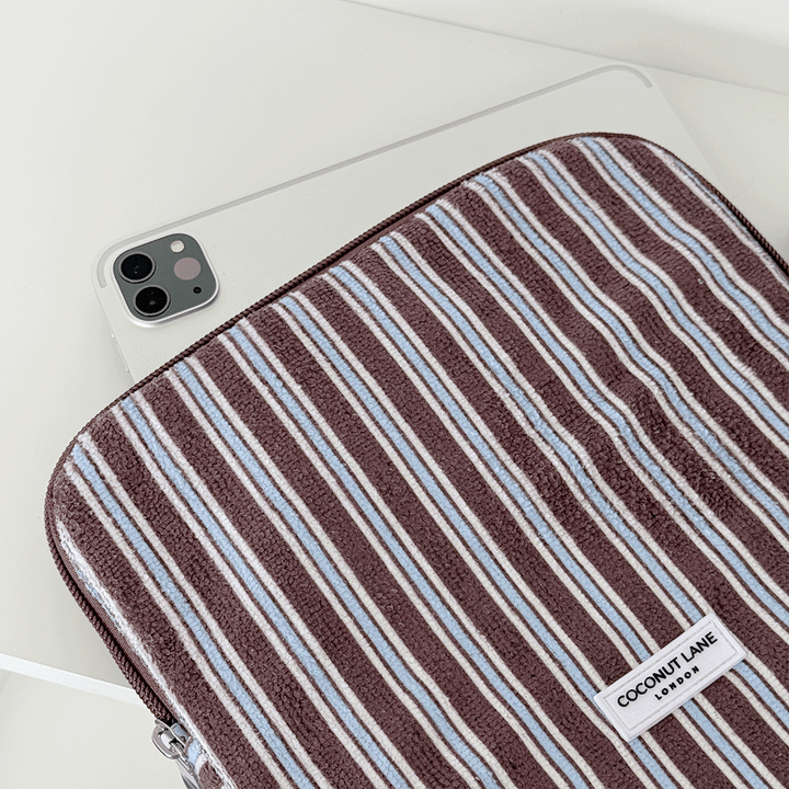 Brown, white and blue striped iPad Sleeve with silver zip and Coconut Lane logo badge.