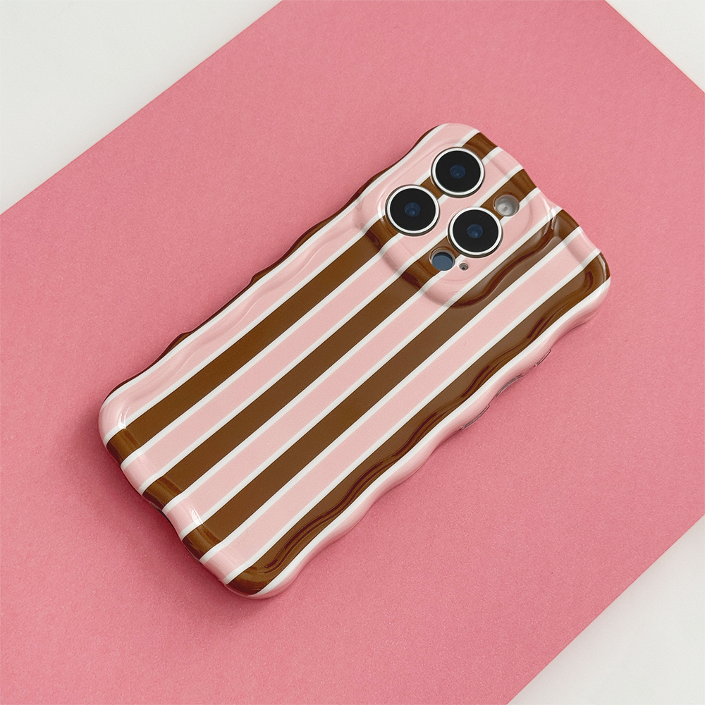Cocoa & Pink Stripe Wavy Phone Case featuring glossy brown, blush pink and cream vertical stripes, photographed diagonally on a pink background.