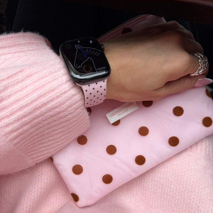 Dot Society Pink and brown Apple watch strap. Baby pink watch strap with dainty brown polka dot design. Alongside the matching dot society everything pouch.