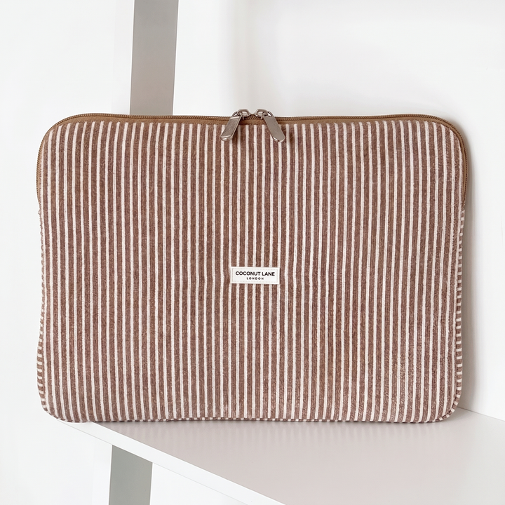 Brown and white striped Laptop Sleeve with zip closure and Coconut Lane logo. 