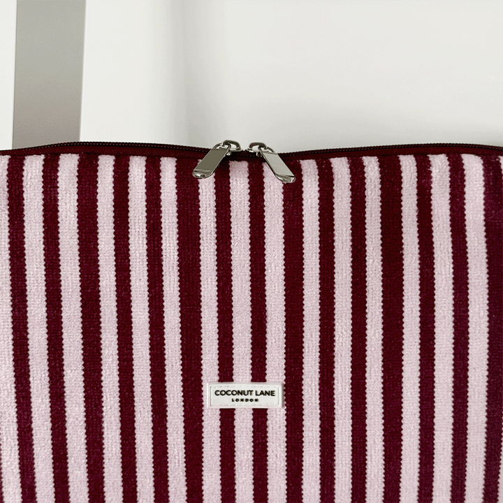 Burgundy and light pink striped Laptop Sleeve, with silver zip and Coconut Lane logo.
