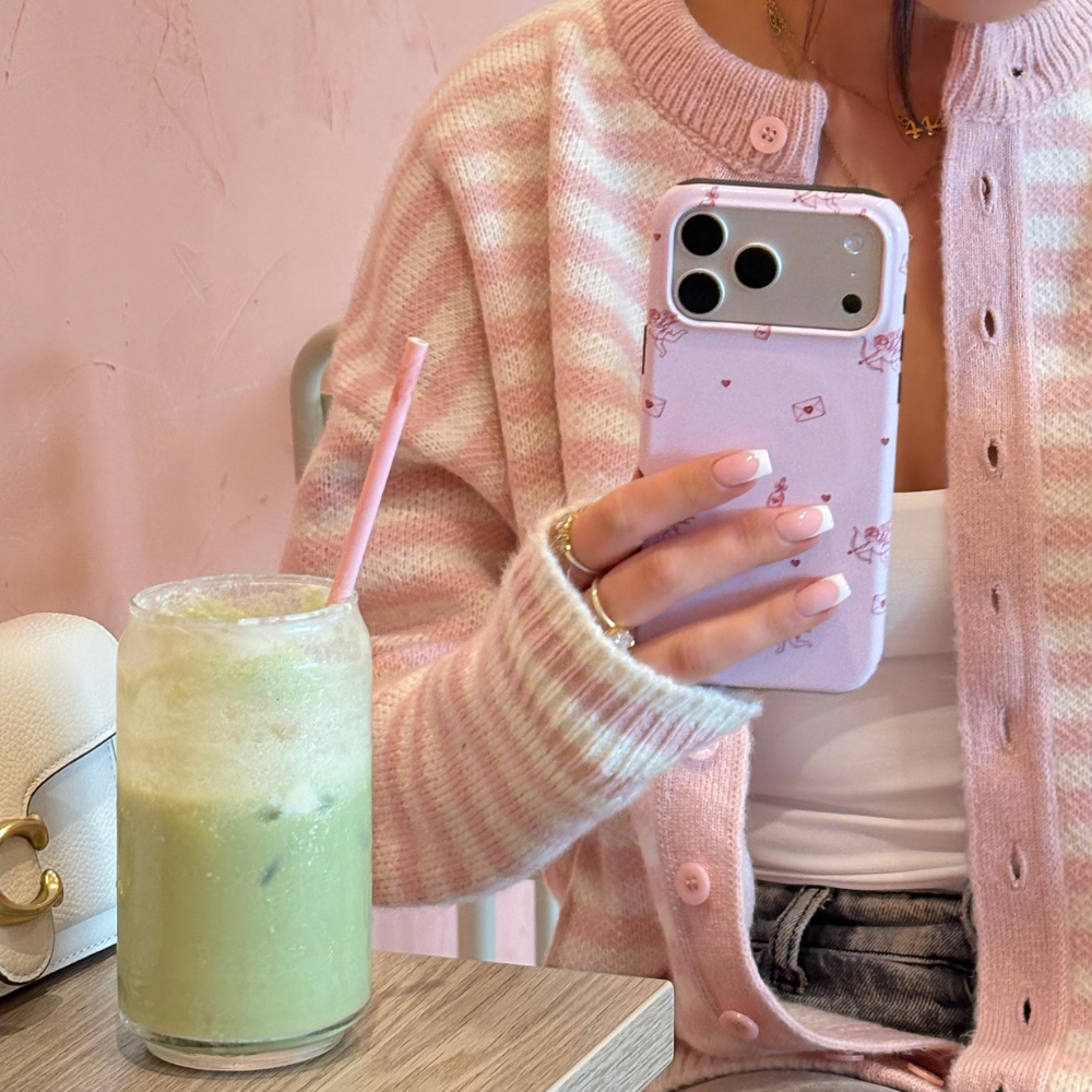 Tough Phone Case Love Notes close up next to a matcha