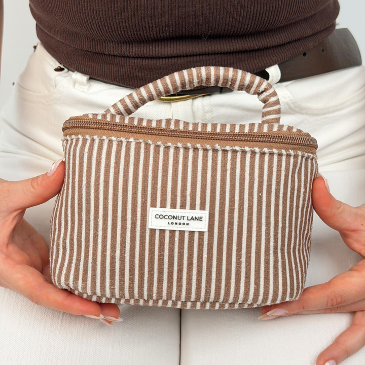Girl holding mini vanity in chestnut stripes