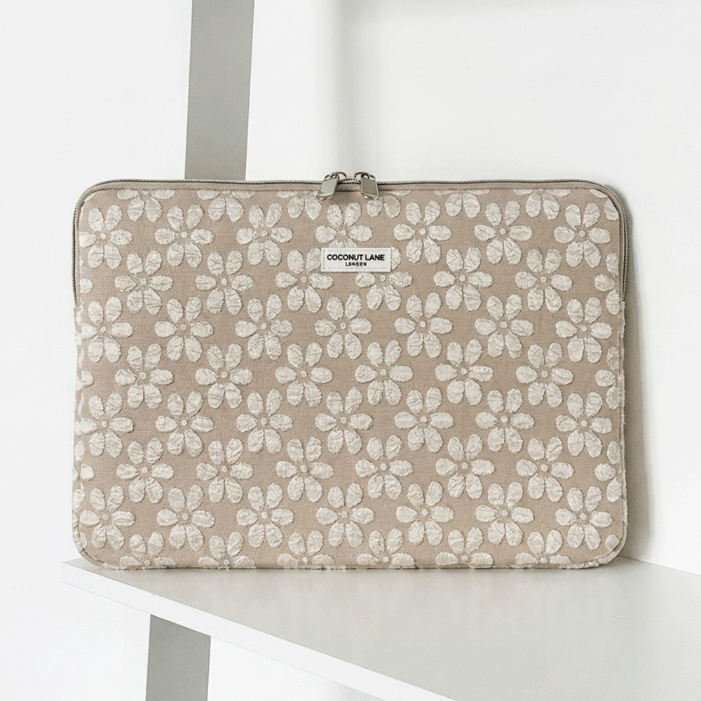 Brown and beige floral design Laptop Sleeve with zip closure and Coconut Lane logo. 