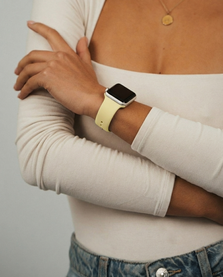 Girl close up of wrist wearing the NAKD Butter Yellow Watch Strap