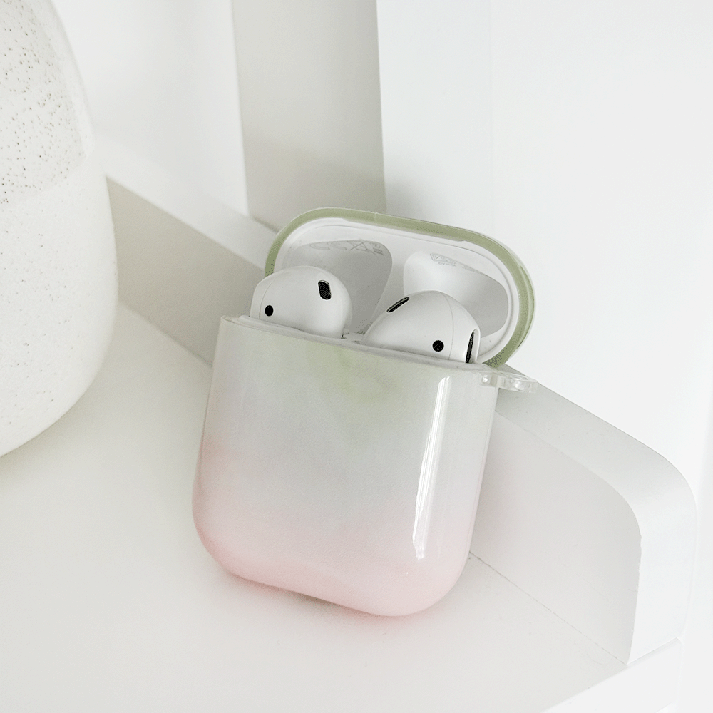 Green and pink ombre effect AirPods Case. Colour fades from green at the top into white, into pink. 