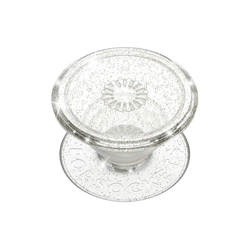 Introducing the Coconut Lane PopSocket Grip in Clear Silver Glitter: a transparent, collapsible grip featuring a circular base inscribed with "PopSockets." This dazzling accessory sparkles when light hits it, adding a touch of glam to your device.