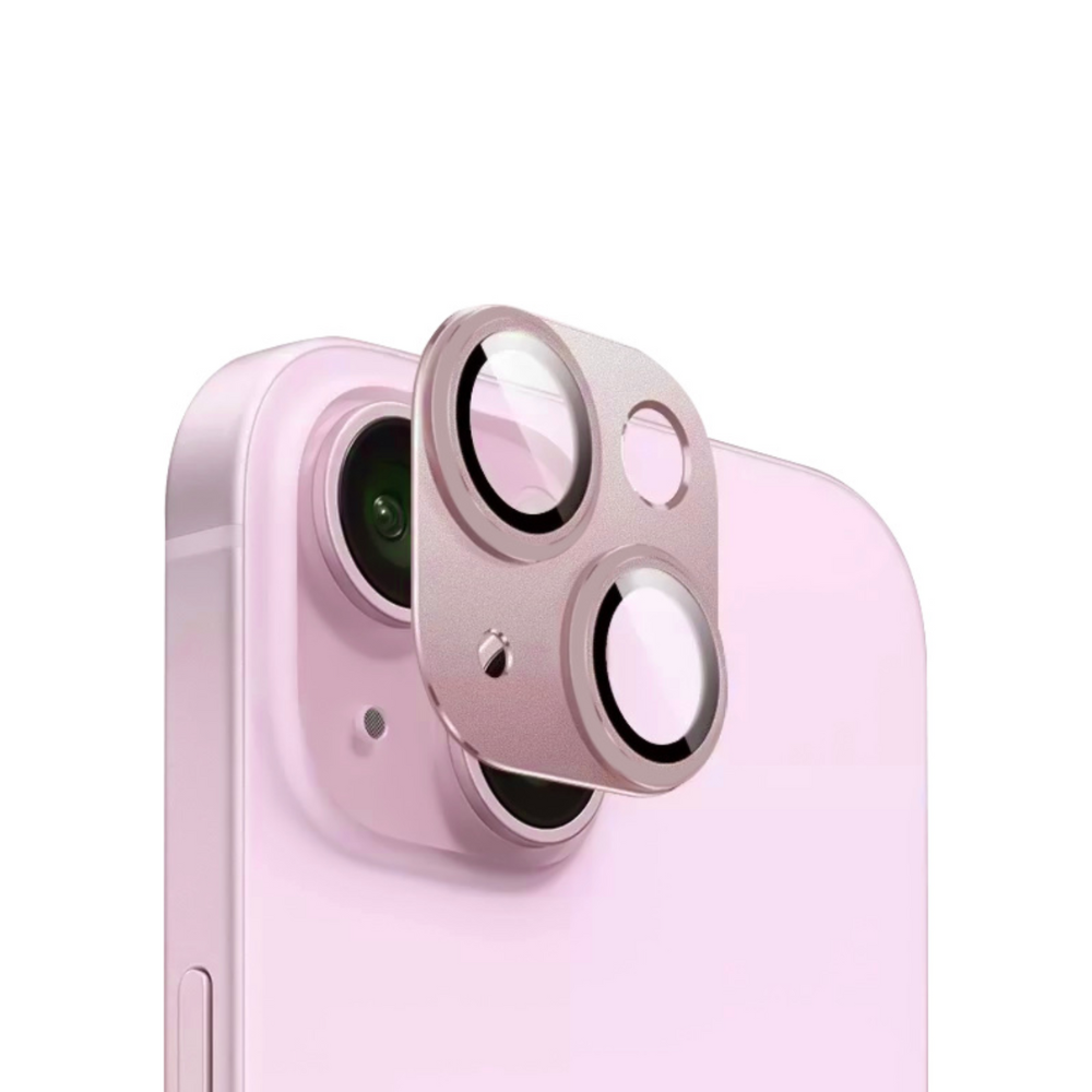 A close-up image of a light pink smartphone with a Coconut Lane Full Protection Camera Lens Cover - Pink partly attached over the camera module. The metallic protector, matching the phone's color, features cutouts for the lenses and flash.