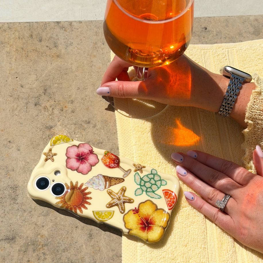 Wavy Island Girl flatlay image by the pool next to aperol spritz