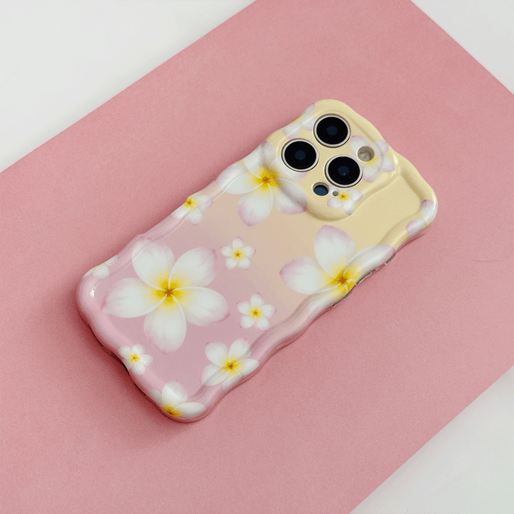 Pink and yellow ombre Wavy Coconut Lane Phone Case with white hibiscus flower design.