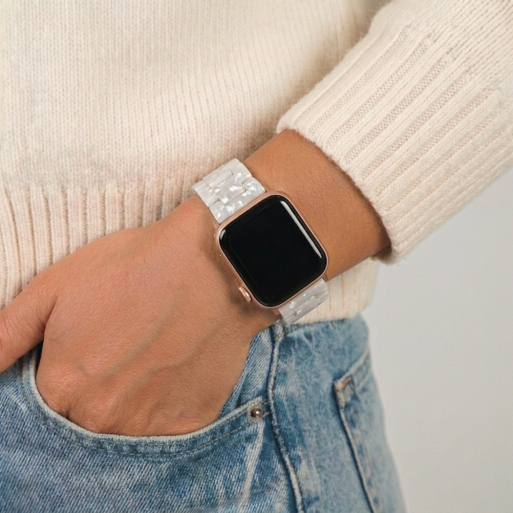Girl hand in pocket wearing the luxe pearl watch strap on wrist