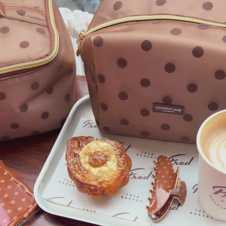 Dot Society Chocolate Brown claw clip, alongside the matching makeup bag, wavy phone case and vanity case.