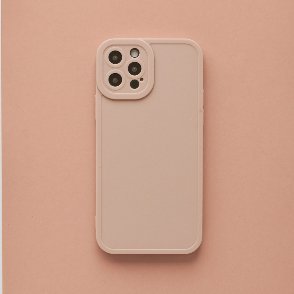 A smartphone with a Coconut Lane NAKD Phone Case in Peach is placed against a matching pastel background. The phone features multiple camera lenses on the top left corner of its back, suggesting advanced photography capabilities, cementing it as one of the core designs among pastel favourites.