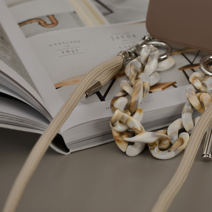 Brown-apple-phone-case-with-nude-short-chain-strap-and-nude-long-lanyard-strap